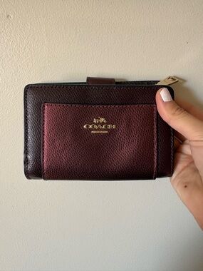 COACH Two-Tone Burgundy Leather Wallet with brass hardware